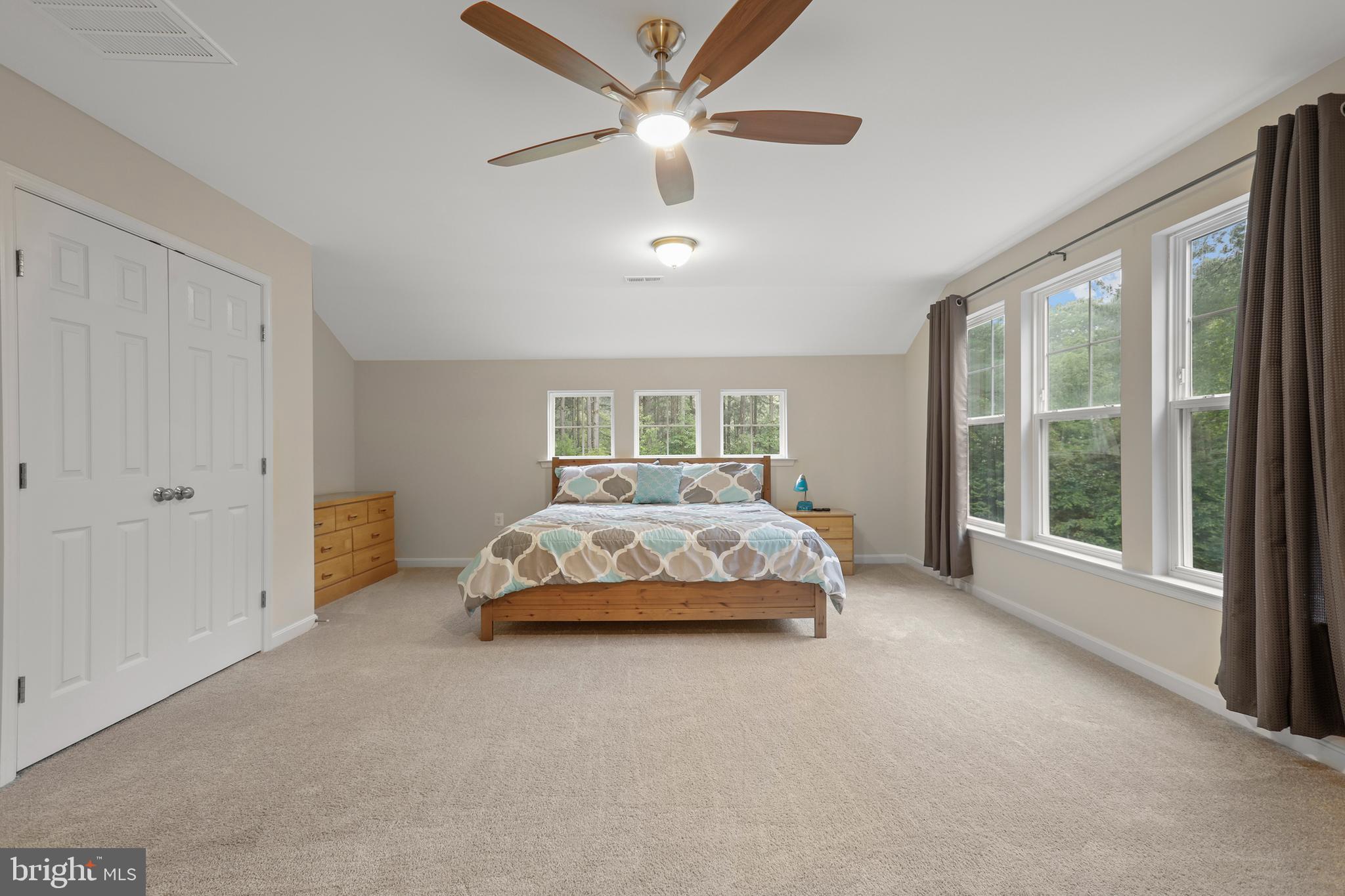 8264 Buckthorne Run King George, VA 22485 - Photo 36 of 50 a spacious bedroom with a bed and a large window