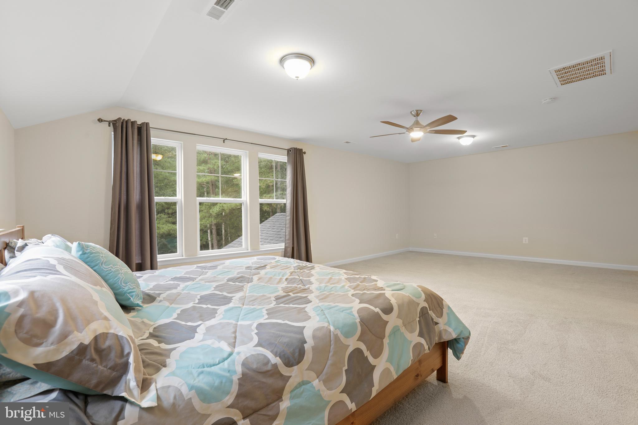 8264 Buckthorne Run King George, VA 22485 - Photo 37 of 50 a bedroom with a bed and a window