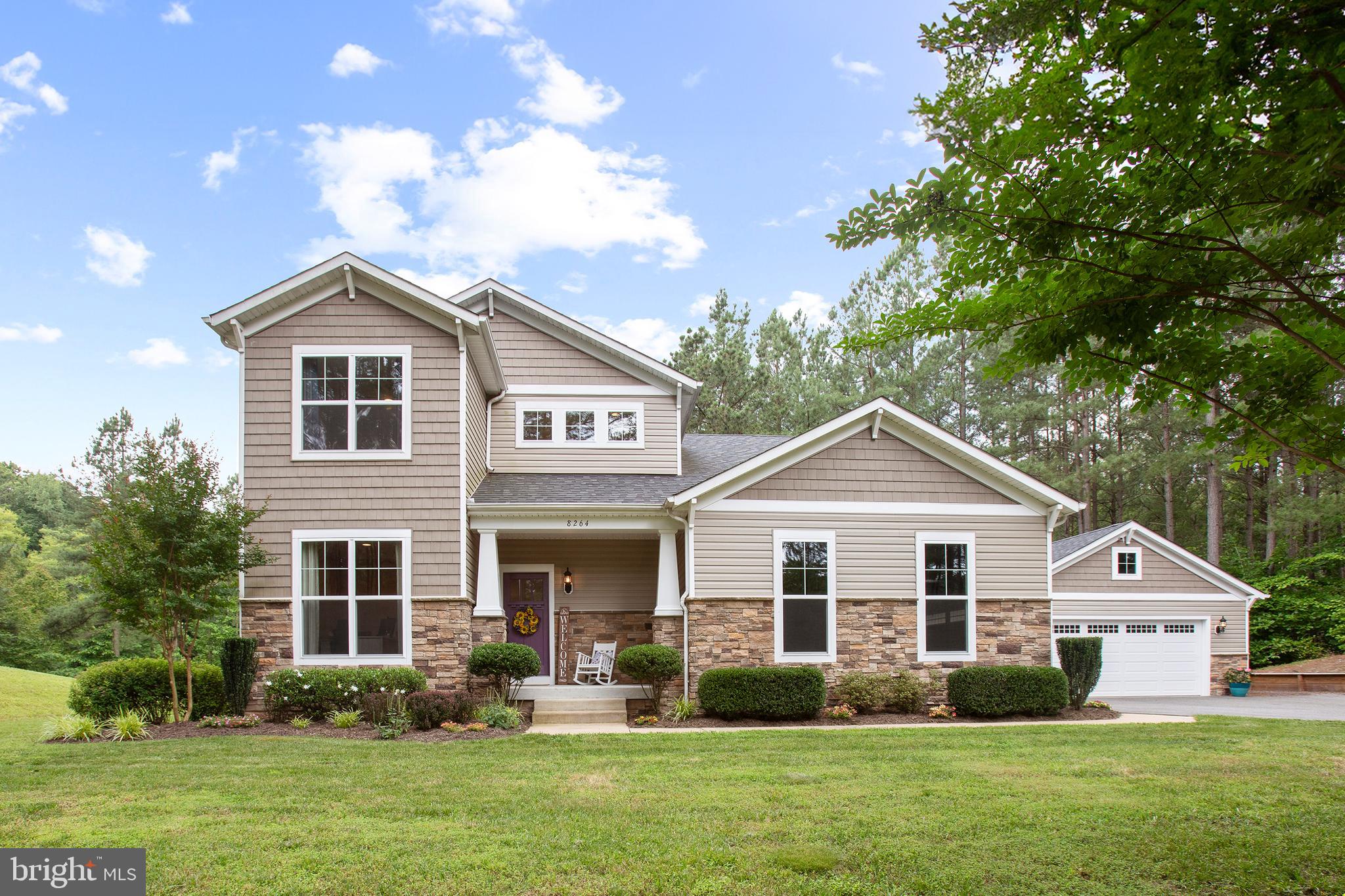 8264 Buckthorne Run King George, VA 22485 - Photo 49 of 50 a front view of a house with garden