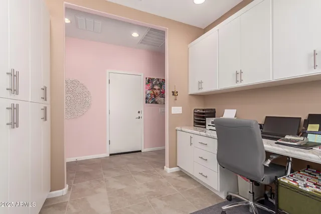 a kitchen with cabinets and appliances