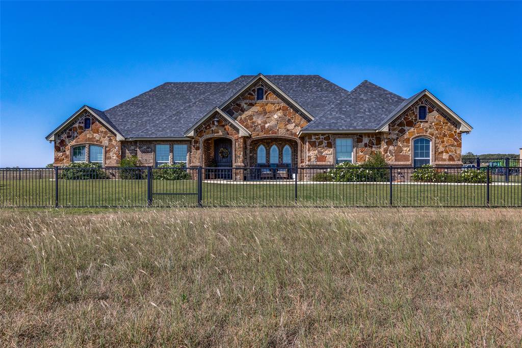 1150 Lone Star Road Bowie, TX 76230 - Photo 5 of 38 front view of a house with a yard