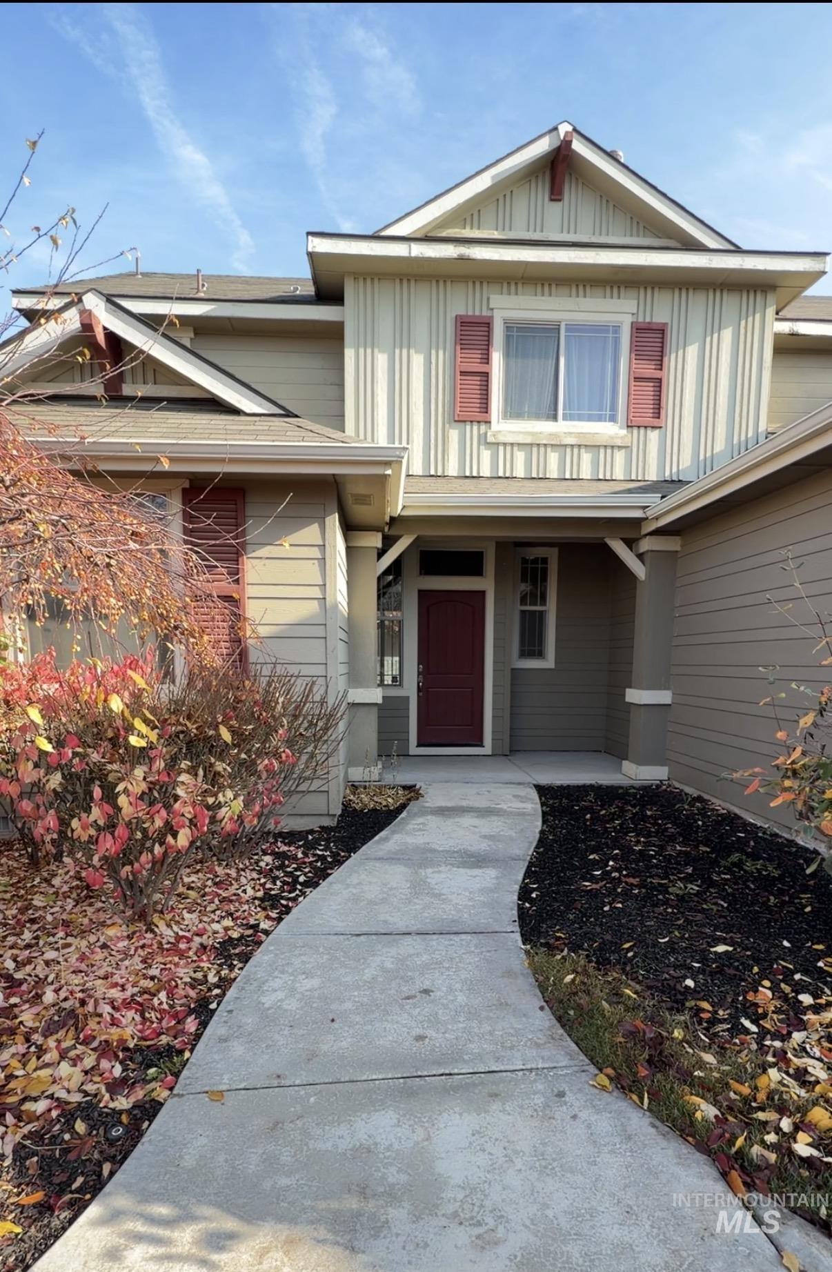 Entrance to property with board and batten siding