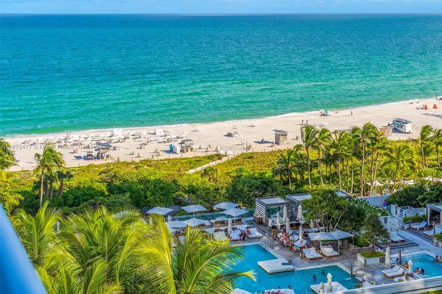 a view of swimming pool with a garden and seating area