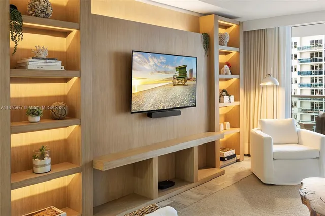 a living room with a couch and a window