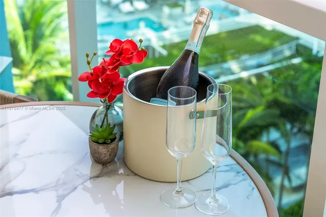 a vase of flowers sitting next to a window