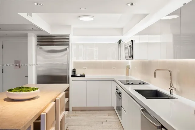 a kitchen that has a sink and a stove