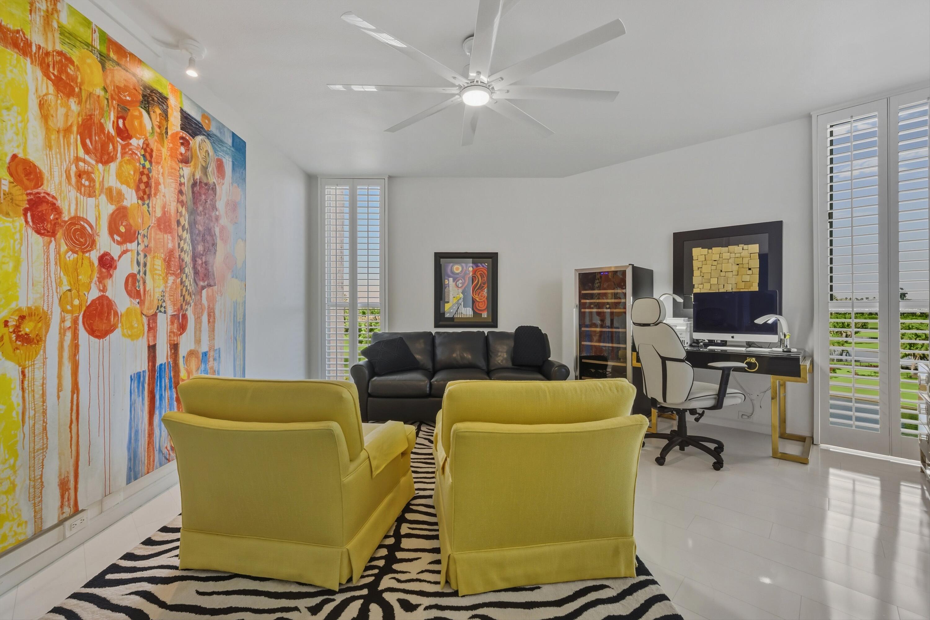 899 Island Drive, Unit 509 Rancho Mirage, CA 92270 - Photo 14 of 32 a living room with furniture a flat screen tv and a window