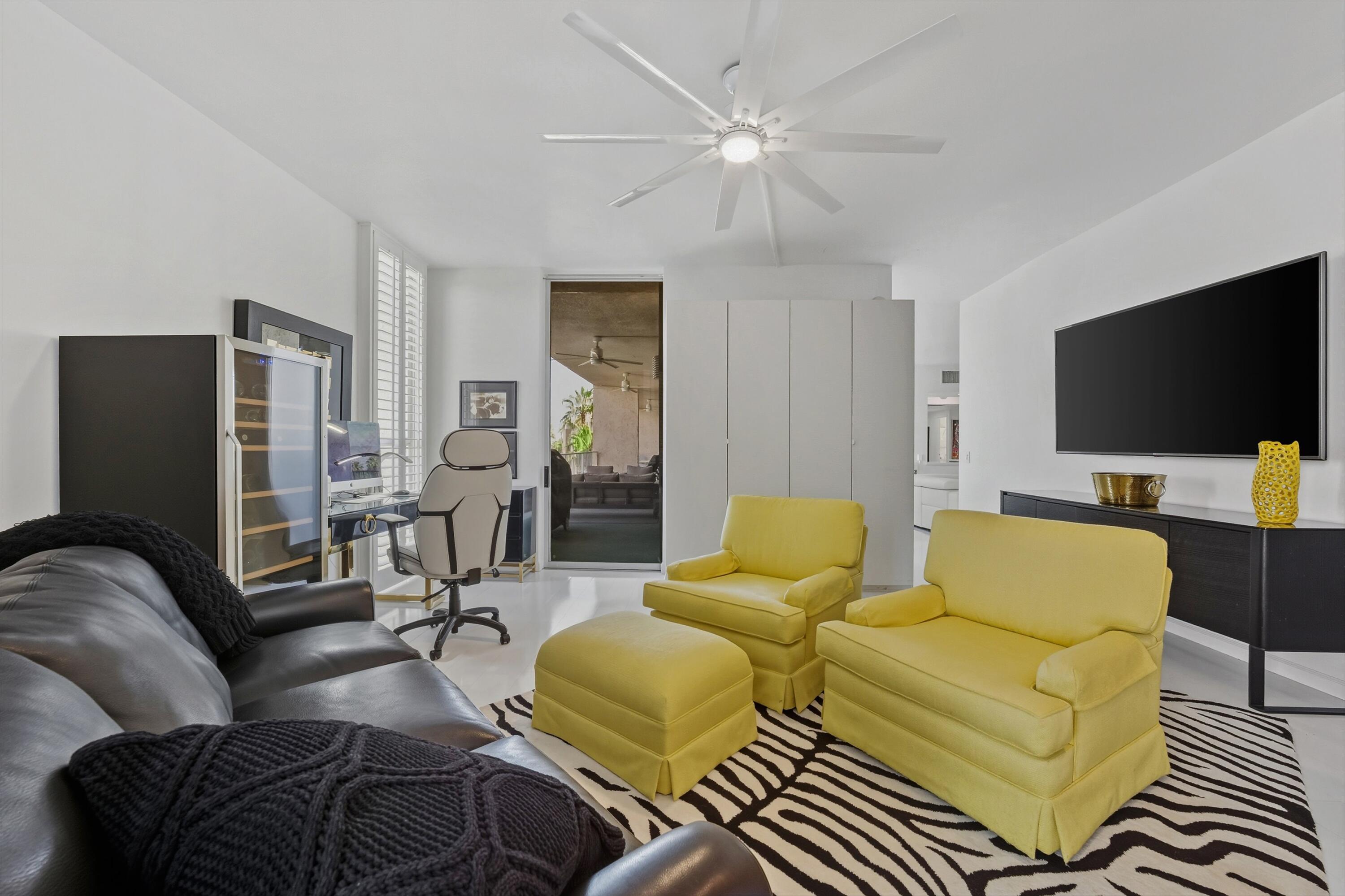 899 Island Drive, Unit 509 Rancho Mirage, CA 92270 - Photo 15 of 32 a living room with furniture and a flat screen tv