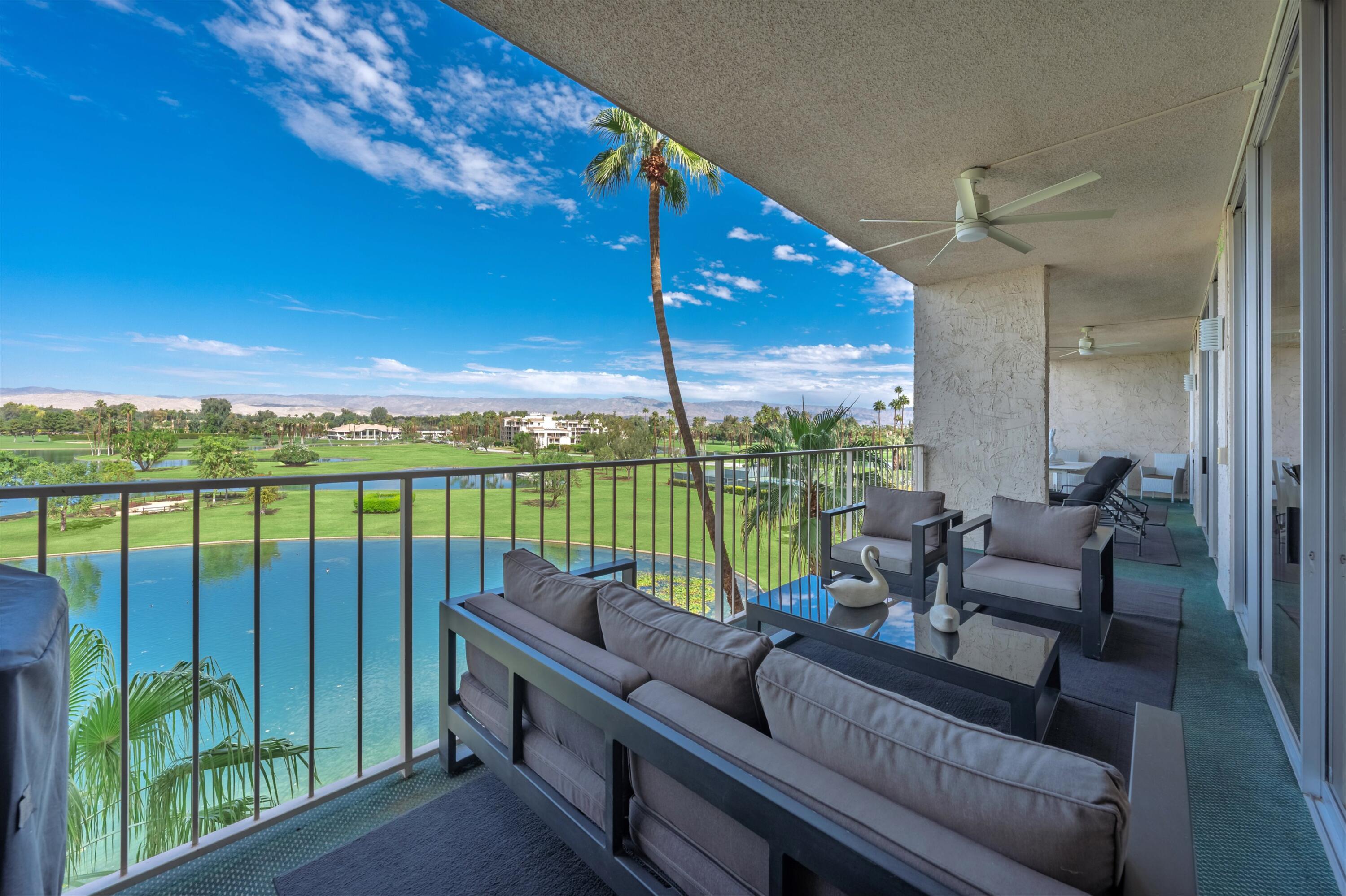 899 Island Drive, Unit 509 Rancho Mirage, CA 92270 - Photo 27 of 32 a balcony with furniture and city view