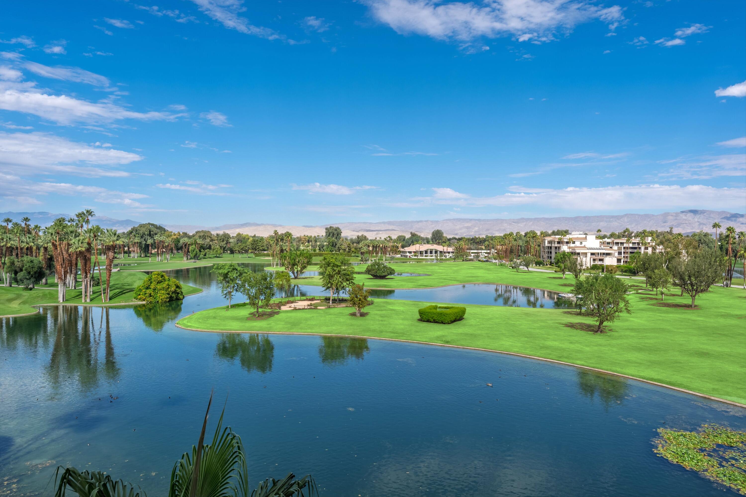 899 Island Drive, Unit 509 Rancho Mirage, CA 92270 - Photo 30 of 32 a view of a lake with a big yard