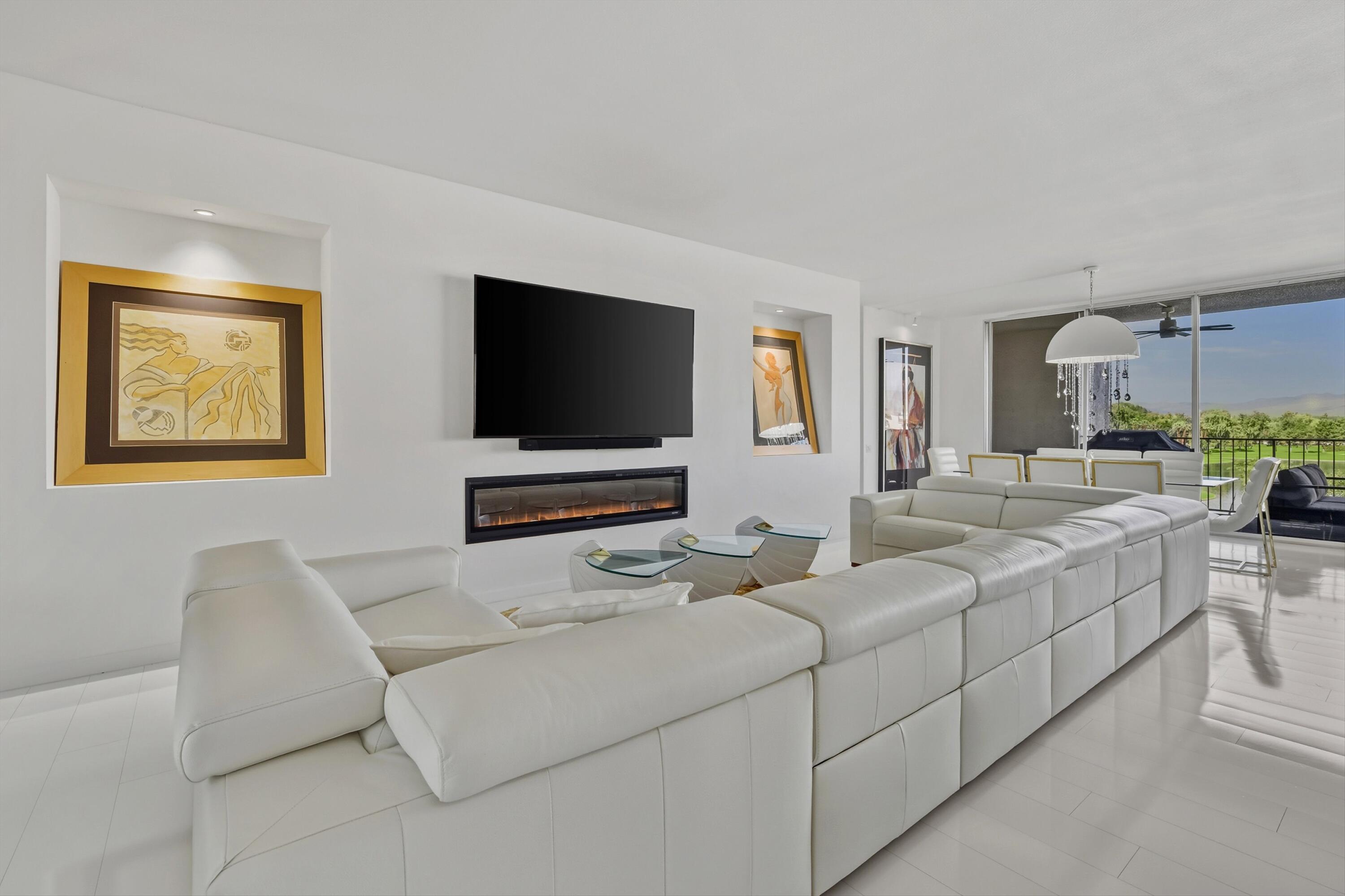899 Island Drive, Unit 509 Rancho Mirage, CA 92270 - Photo 4 of 32 a living room with furniture and a flat screen tv