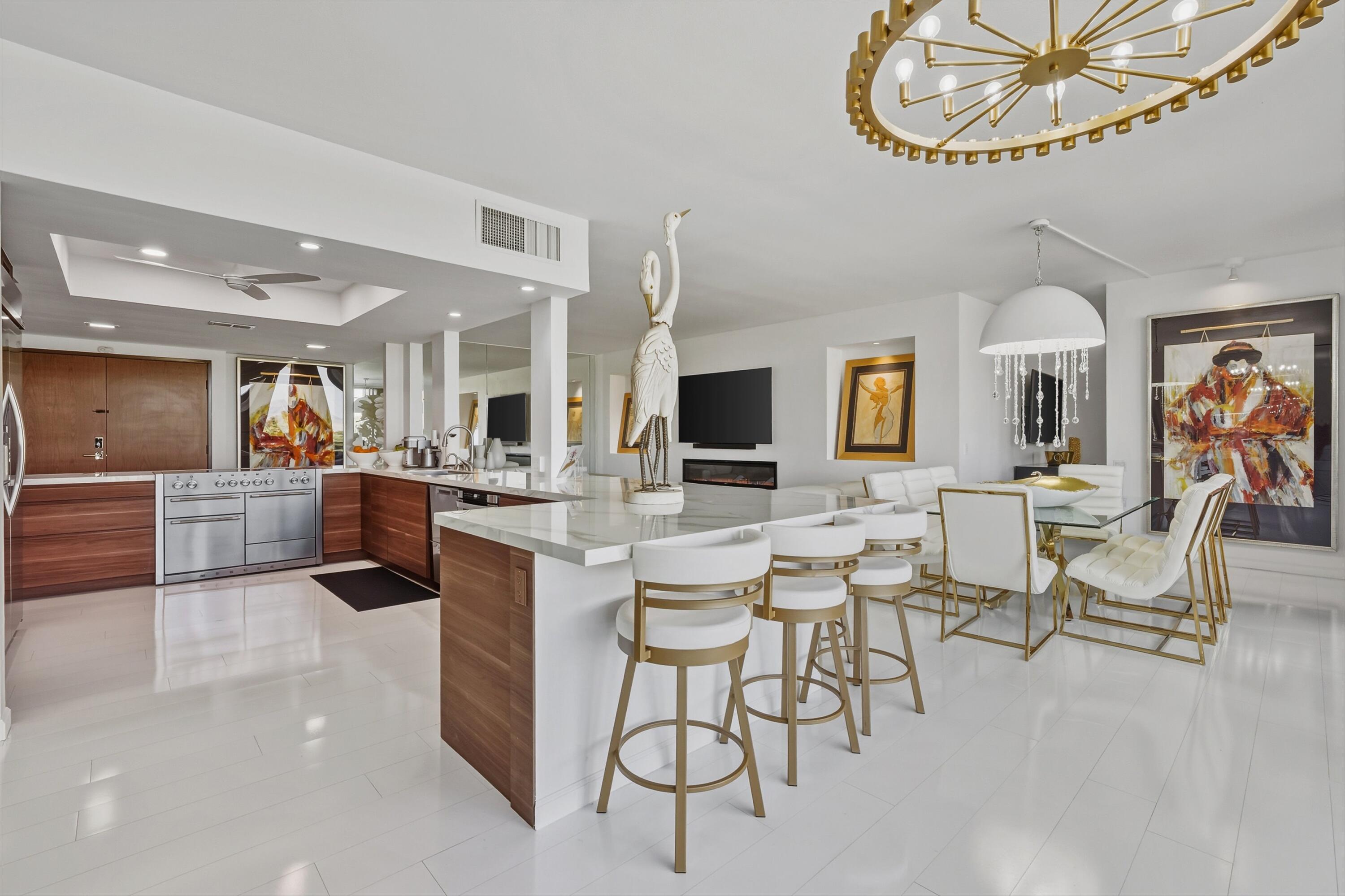 899 Island Drive, Unit 509 Rancho Mirage, CA 92270 - Photo 7 of 32 a view of a dining room with furniture and a chandelier
