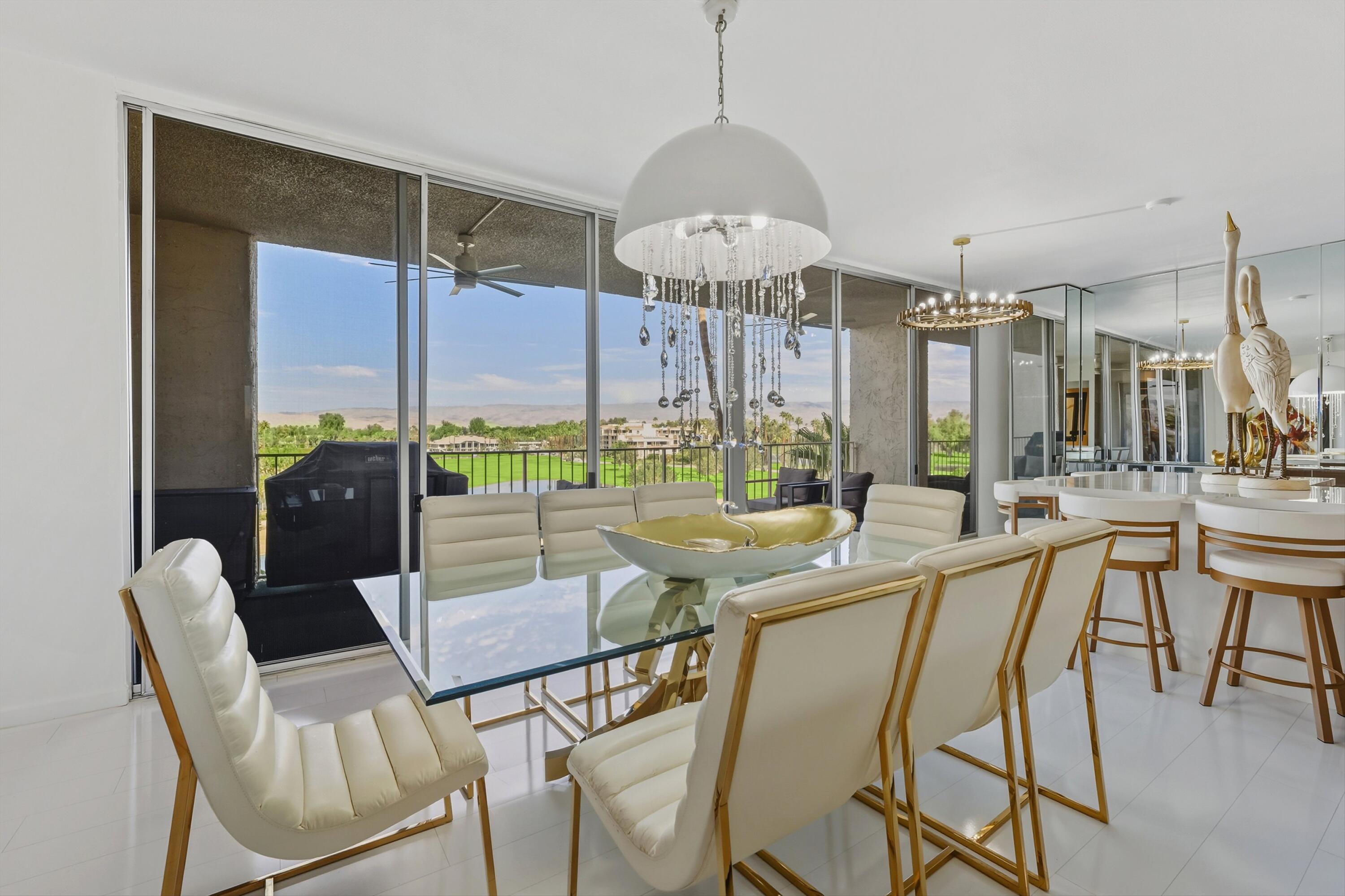 899 Island Drive, Unit 509 Rancho Mirage, CA 92270 - Photo 9 of 32 a view of a dining room with furniture window and outside view