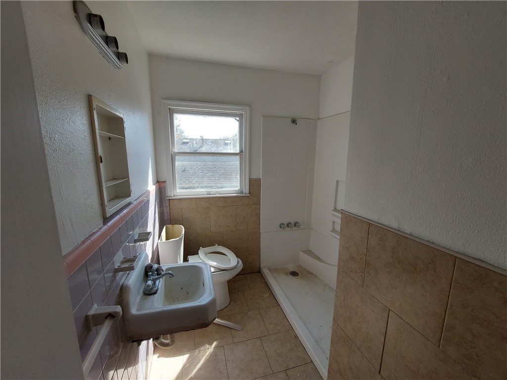 1731 15th Street Corpus Christi, TX 78404 - Photo 9 of 20 a bathroom with a sink and a mirror