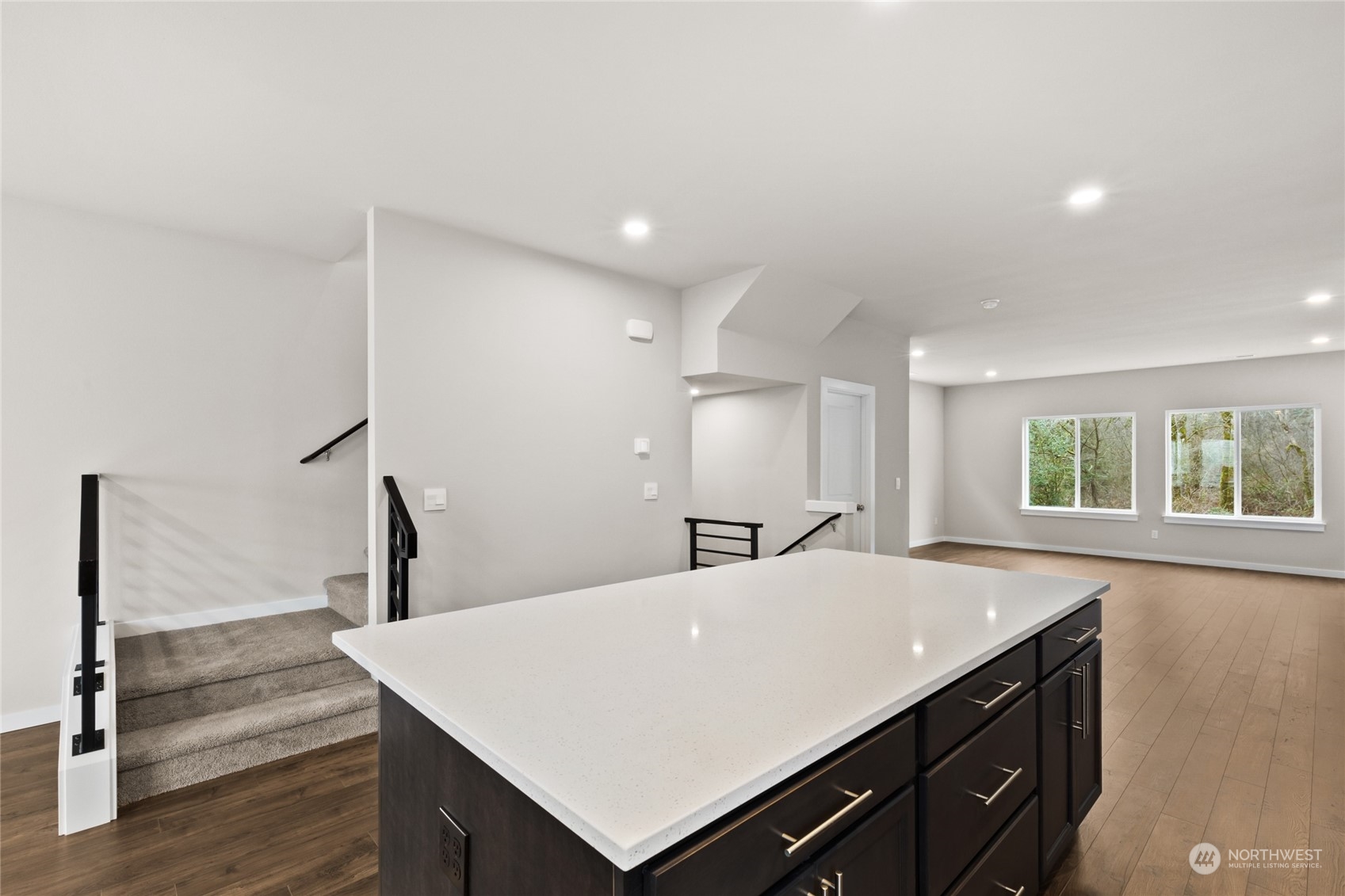 413 207th Street Southeast Bothell, WA 98012 - Photo 12 of 32 a view of a kitchen counter top space with furniture and windows