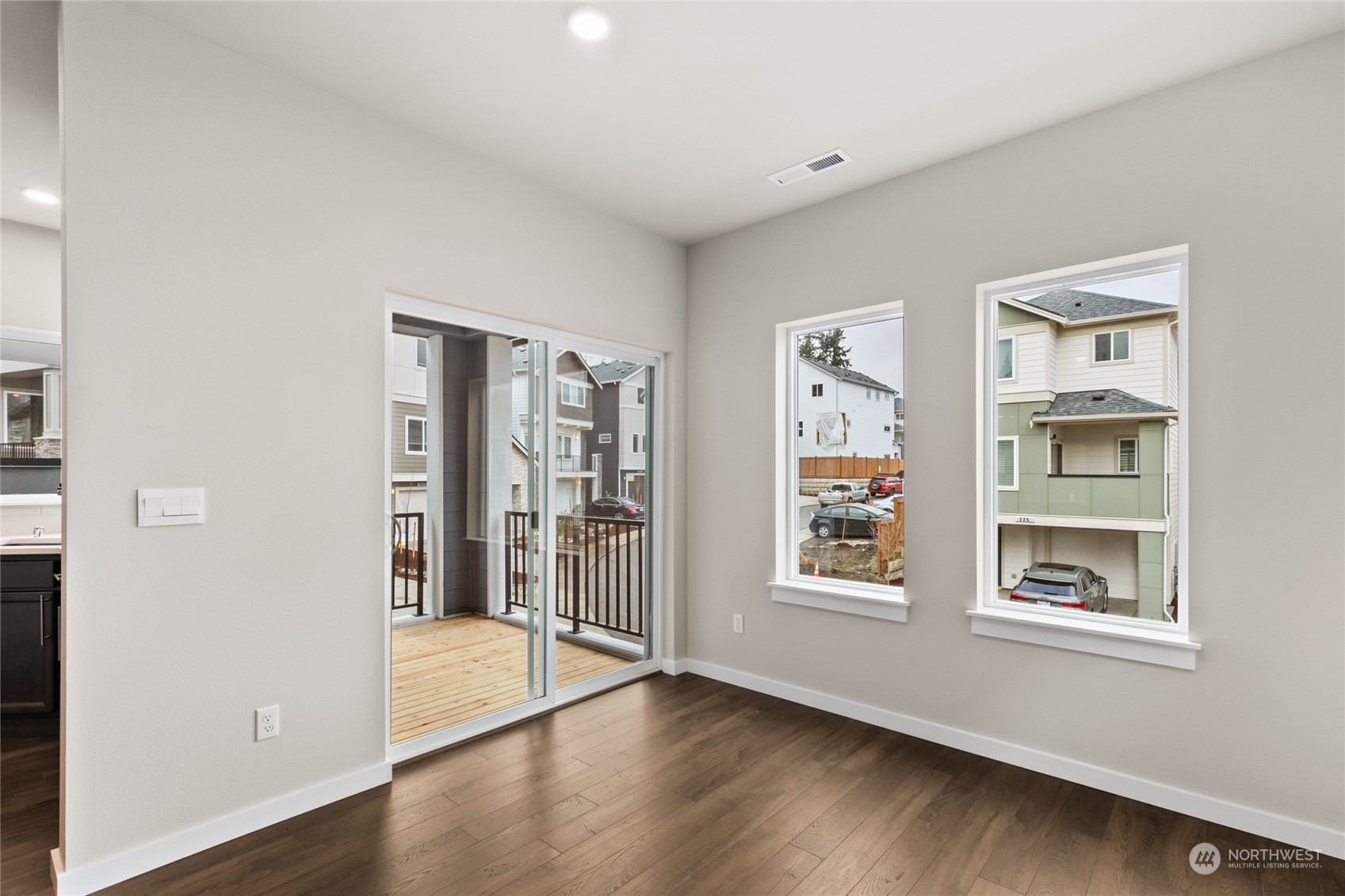 413 207th Street Southeast Bothell, WA 98012 - Photo 15 of 32 a view of an empty room with window and wooden floor