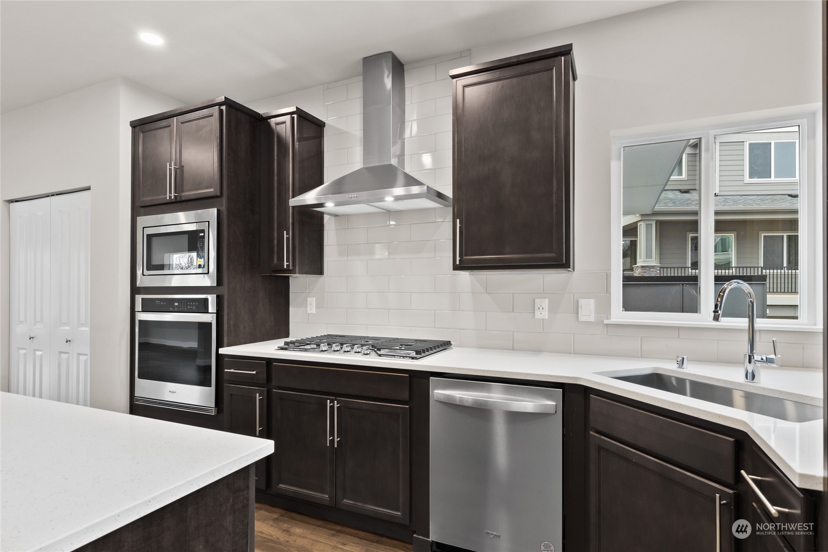 413 207th Street Southeast Bothell, WA 98012 - Photo 2 of 32 a kitchen with stainless steel appliances a sink stove and refrigerator