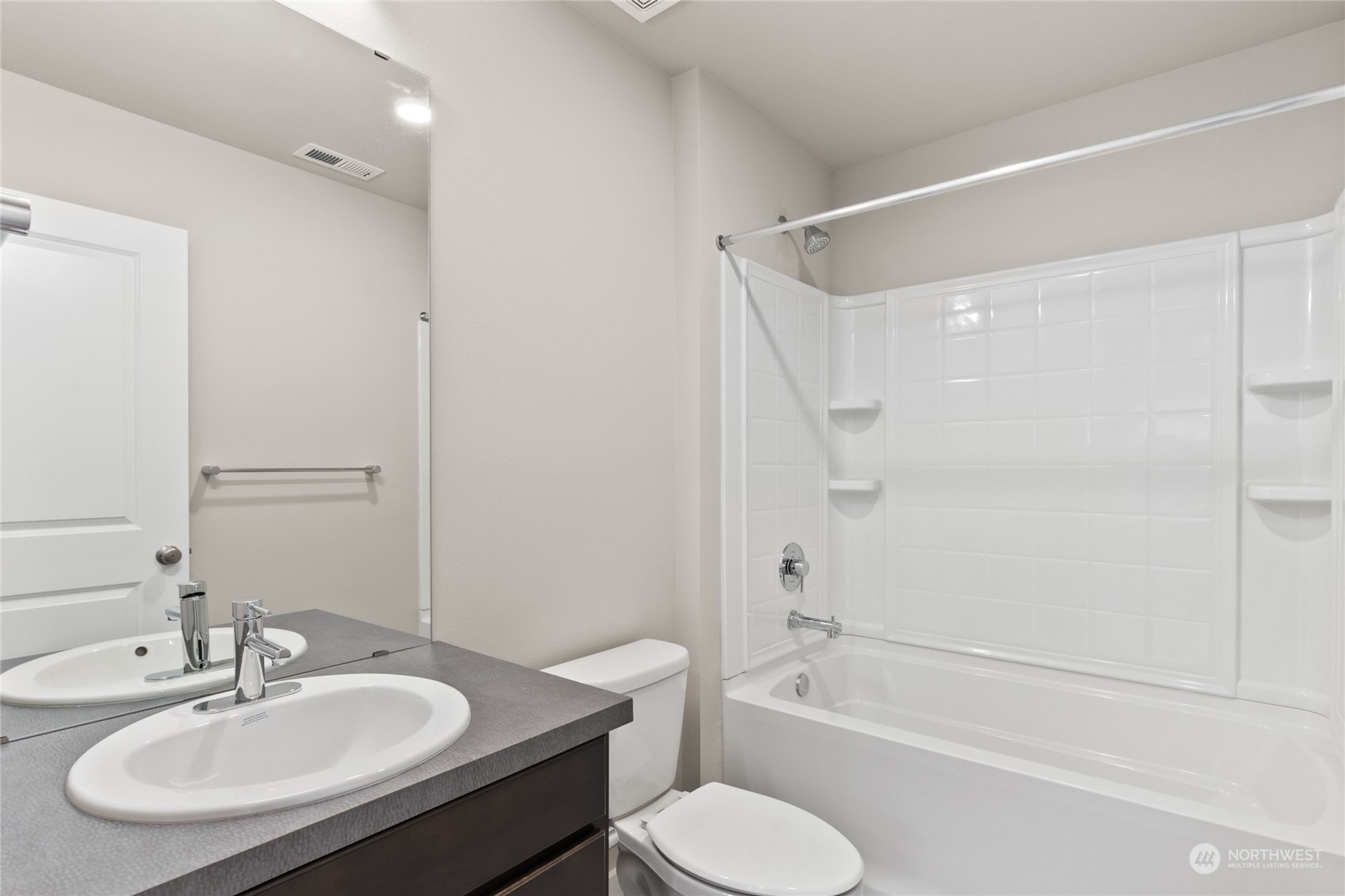 413 207th Street Southeast Bothell, WA 98012 - Photo 23 of 32 a bathroom with a sink toilet and a bathtub