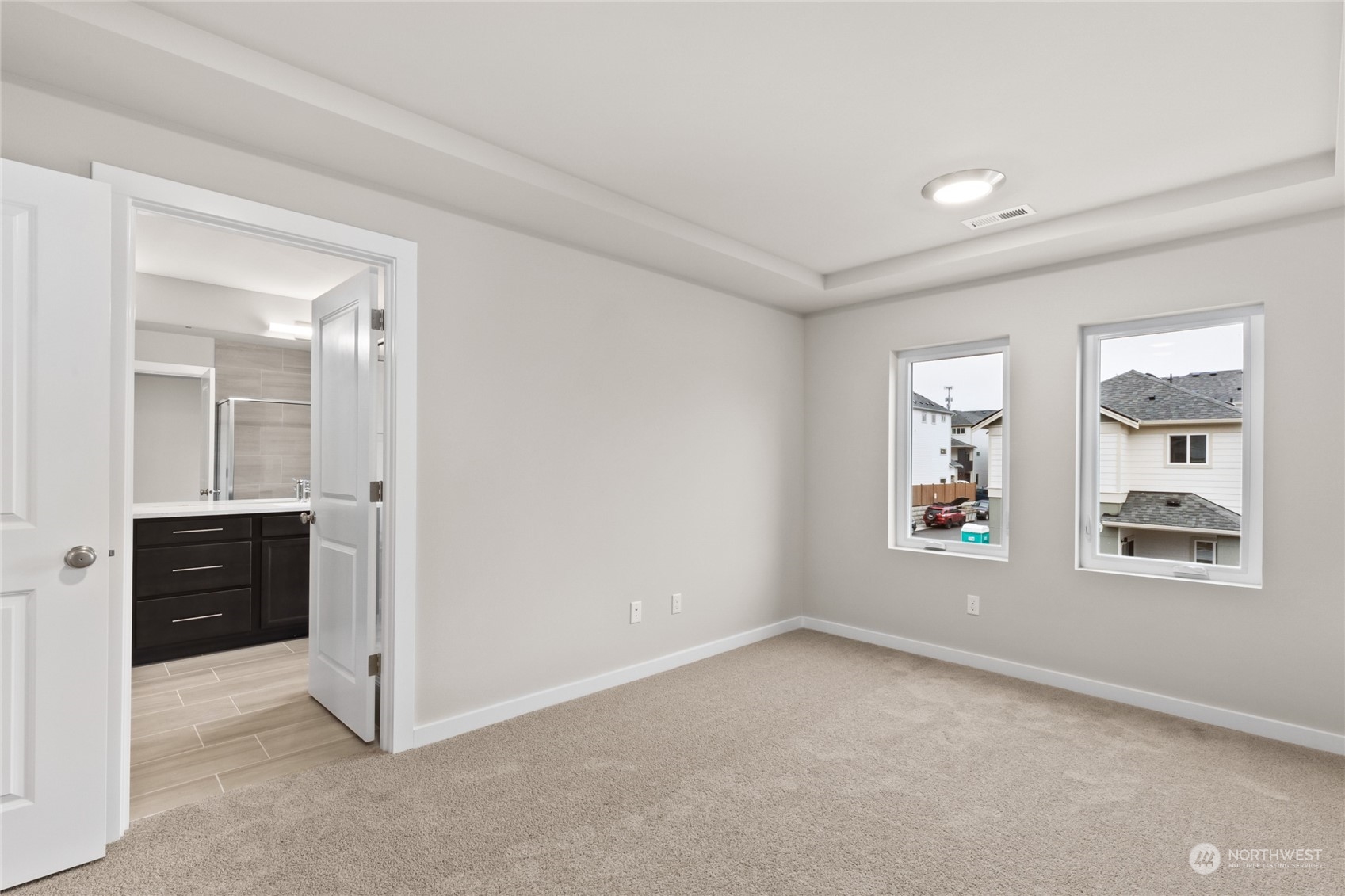 413 207th Street Southeast Bothell, WA 98012 - Photo 4 of 32 an empty room with windows and cabinet
