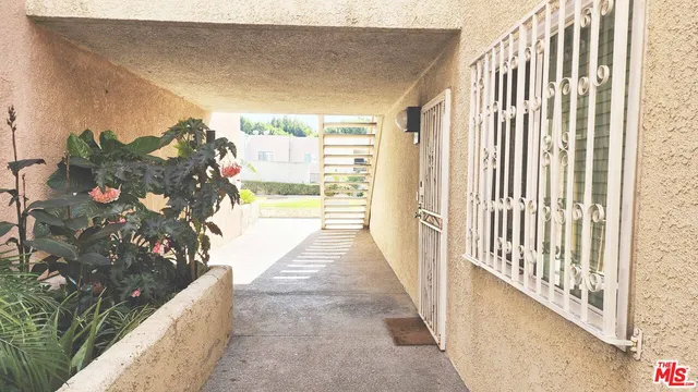 a view of a building with a yard