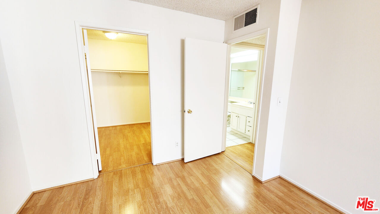 1425 West 12th Street, Unit 161 Los Angeles, CA 90015 - Photo 9 of 19 a view of a room with wooden floor