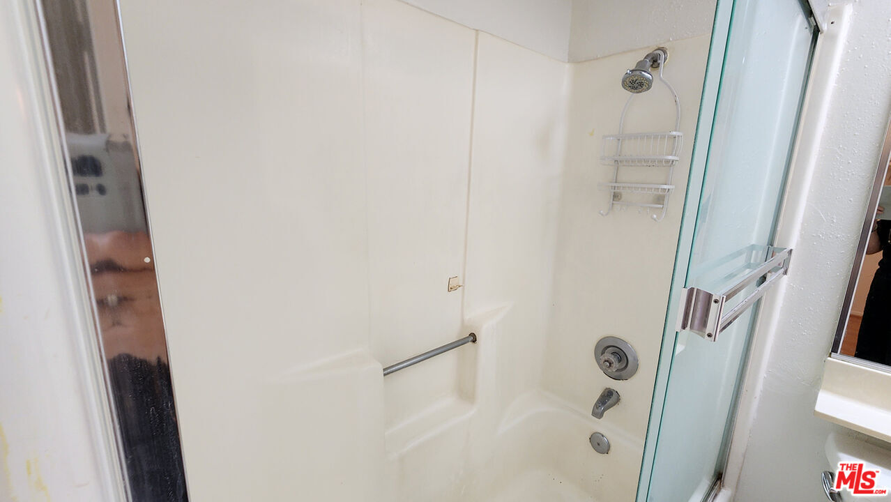 1425 West 12th Street, Unit 161 Los Angeles, CA 90015 - Photo 10 of 19 a bathroom with a shower and a mirror