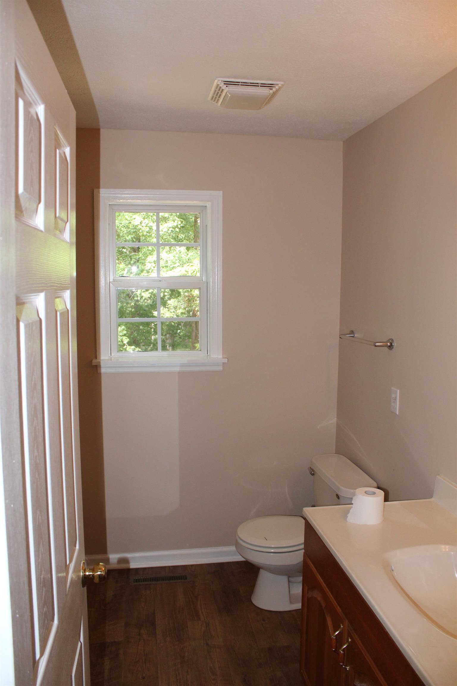 278 Baker Road Dickson, TN 37055 - Photo 13 of 26 a bathroom with a granite countertop toilet and sink