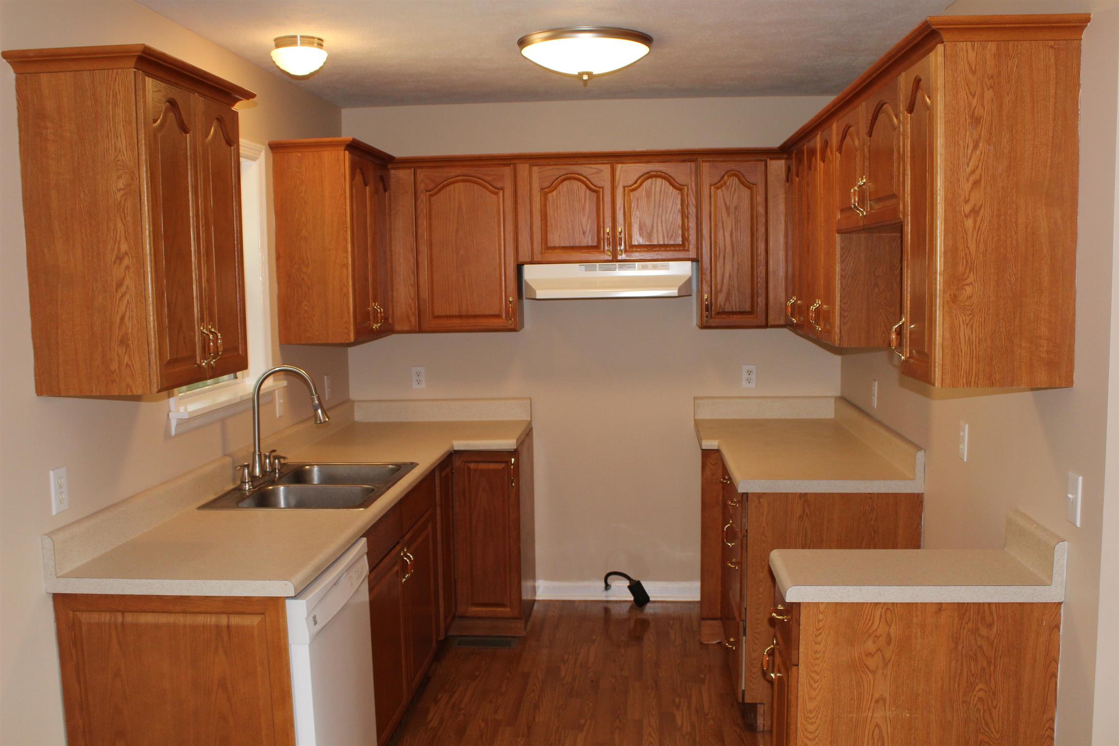 278 Baker Road Dickson, TN 37055 - Photo 3 of 26 a kitchen with a sink a refrigerator and cabinets