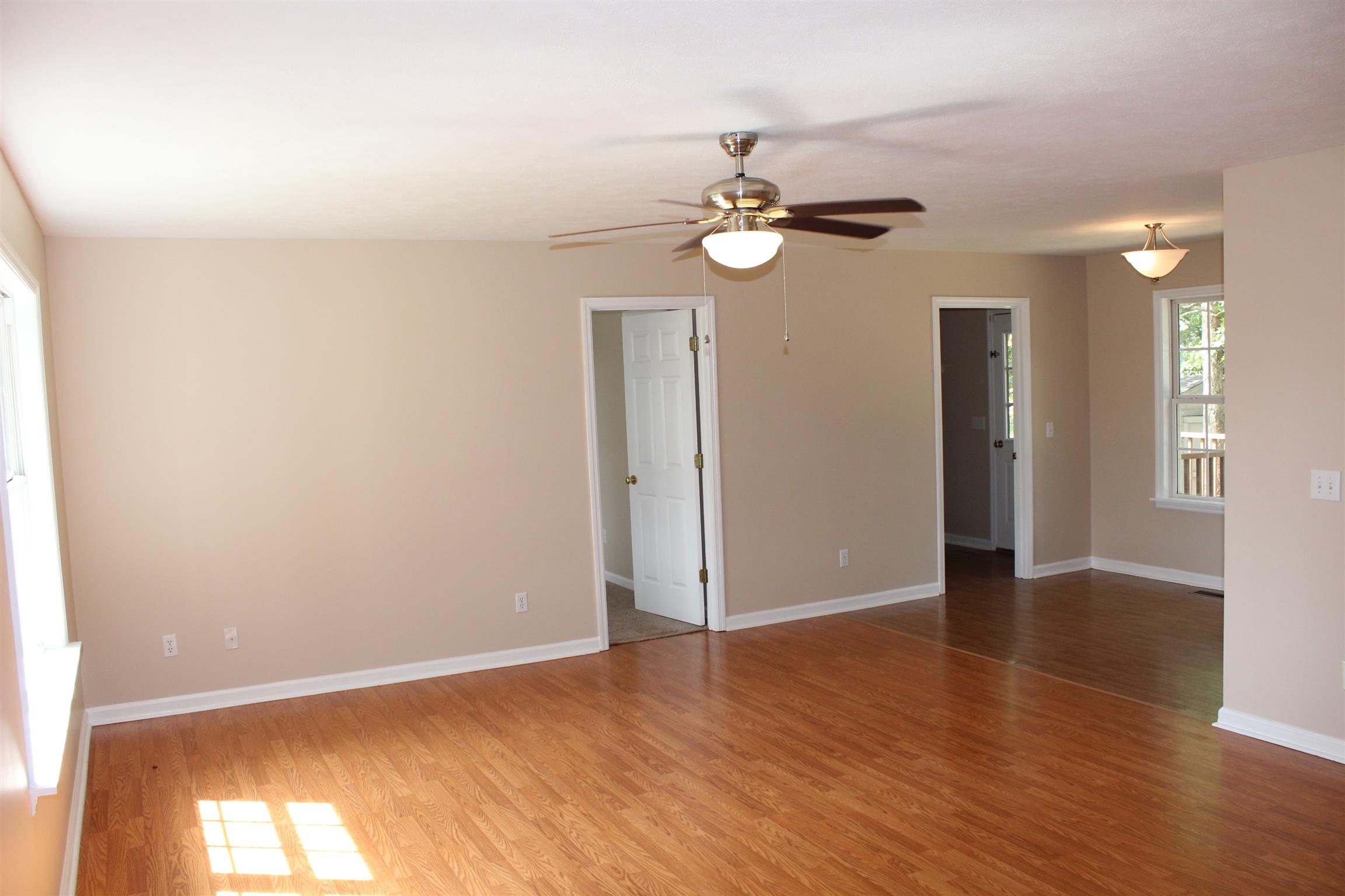 278 Baker Road Dickson, TN 37055 - Photo 4 of 26 an empty room with wooden floor and fan