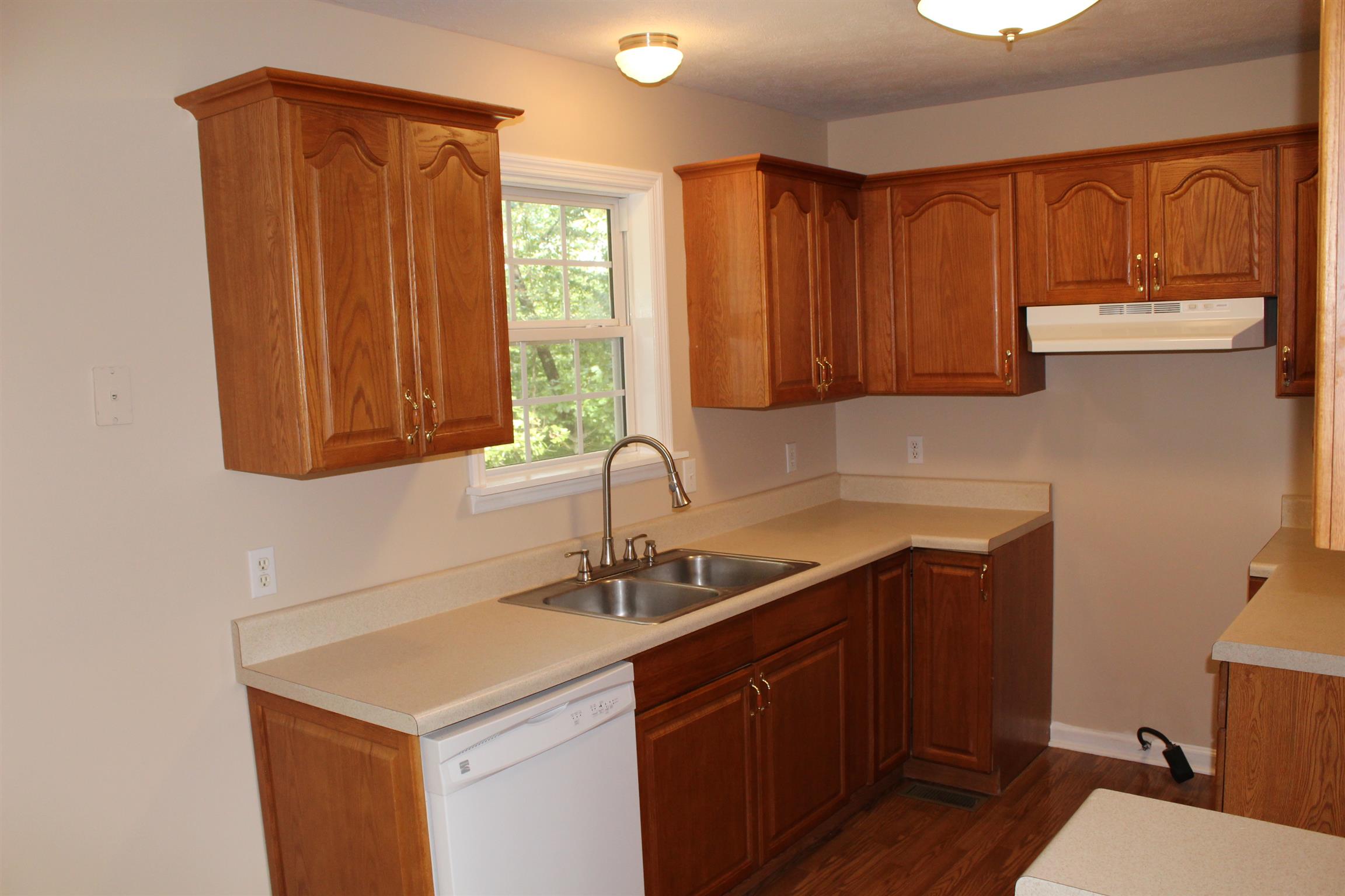 278 Baker Road Dickson, TN 37055 - Photo 6 of 26 a kitchen with a sink cabinets and window