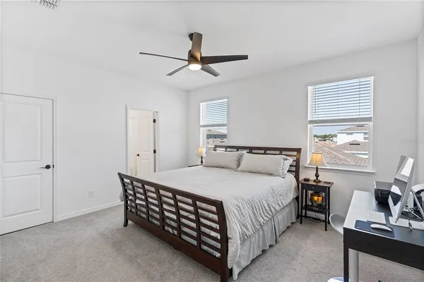 a bedroom with a bed and a dresser in it