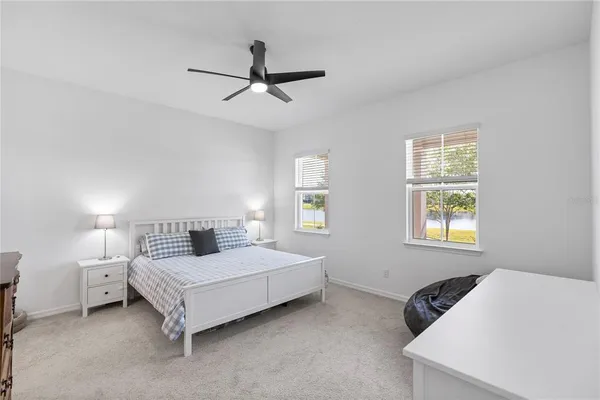 a bedroom with a bed and window