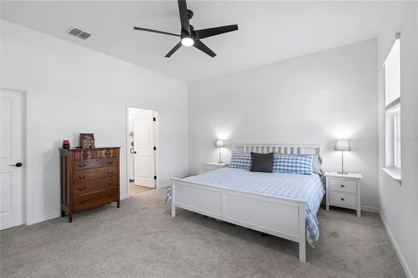 a bedroom with a bed and a cabinets