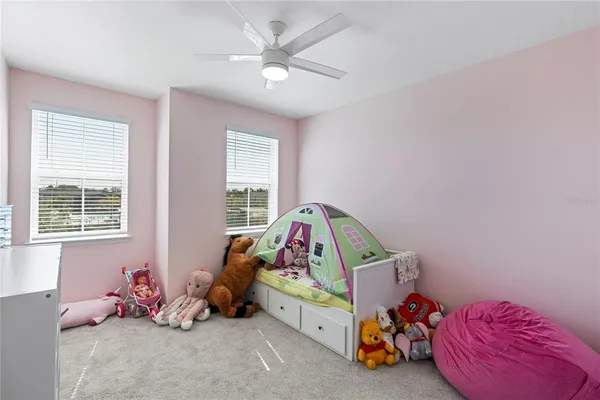 a bedroom with furniture and a window