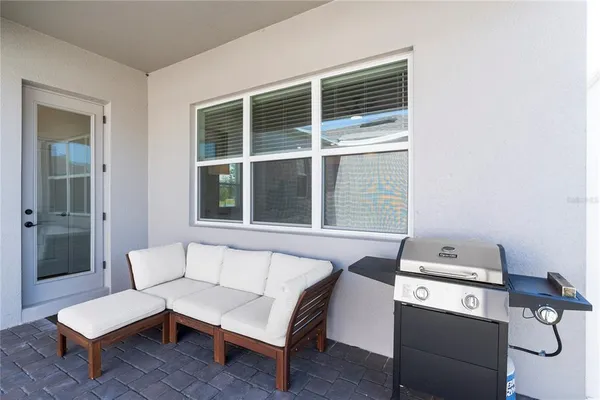 a living room with furniture and a window