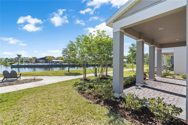 a view of a house with a yard and a patio