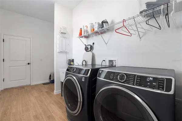 a utility room with dryer and washer