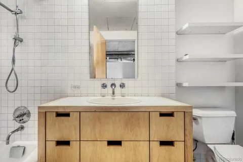a bathroom with a sink and mirror