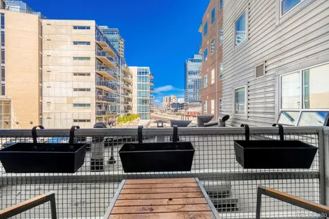 a view of a balcony with chairs