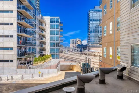a view of a patio with couches and potted plants