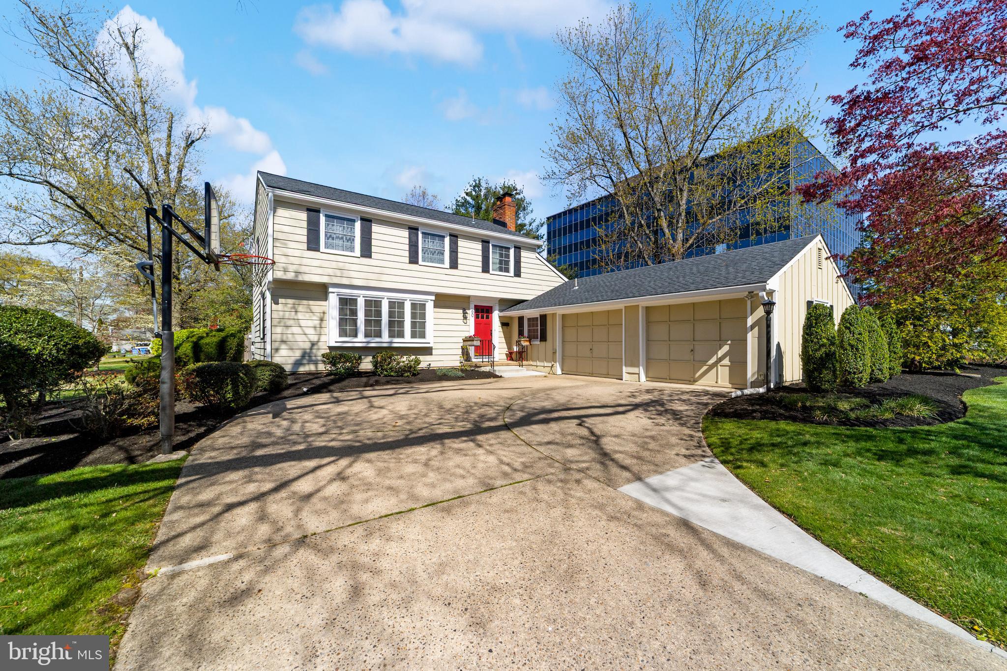 a front view of a house with a yard and outdoor seating