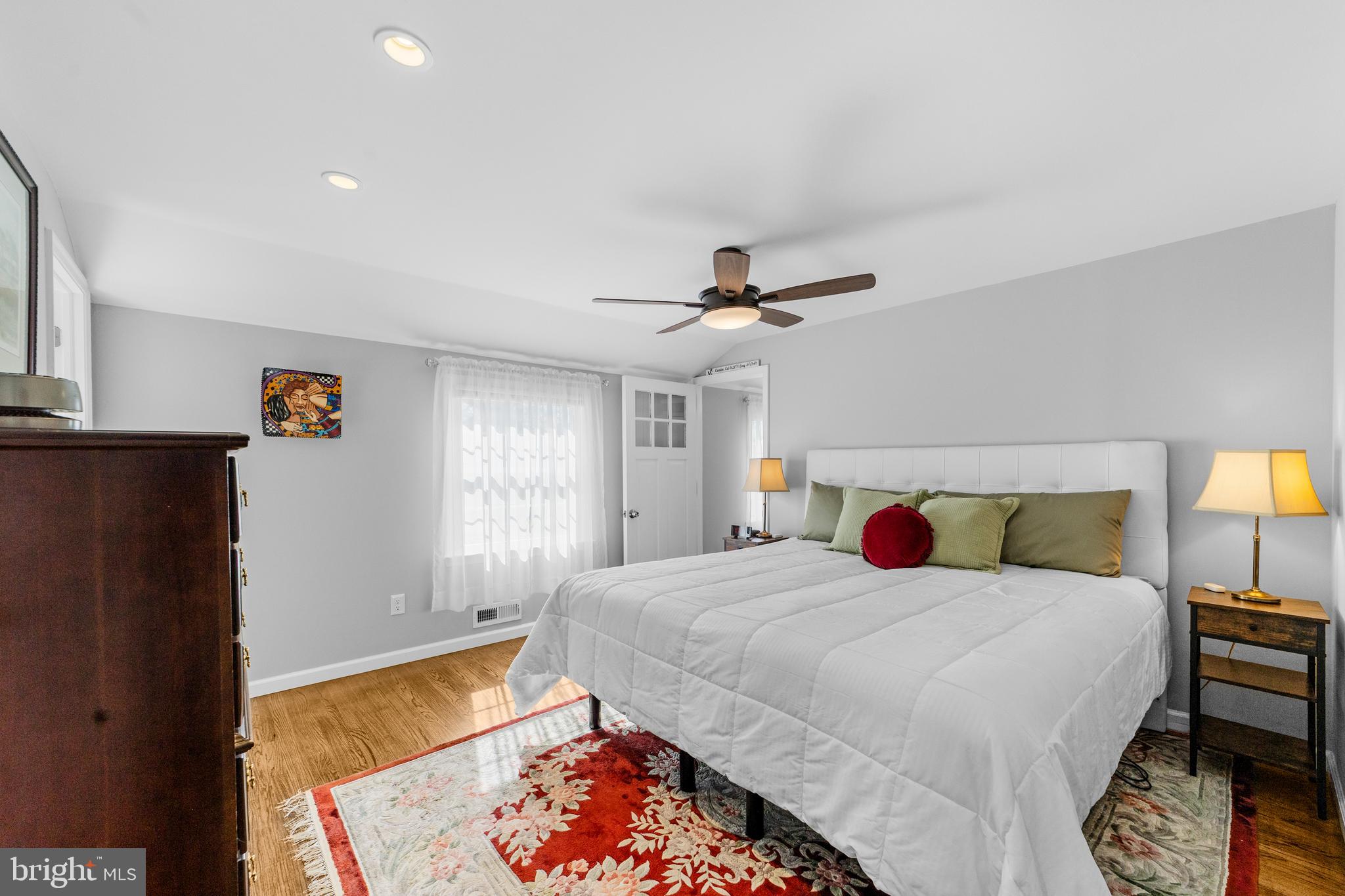 60 Pine Valley Road Cherry Hill, NJ 08034 - Photo 20 of 30 a bedroom with a bed and a lamp on dresser
