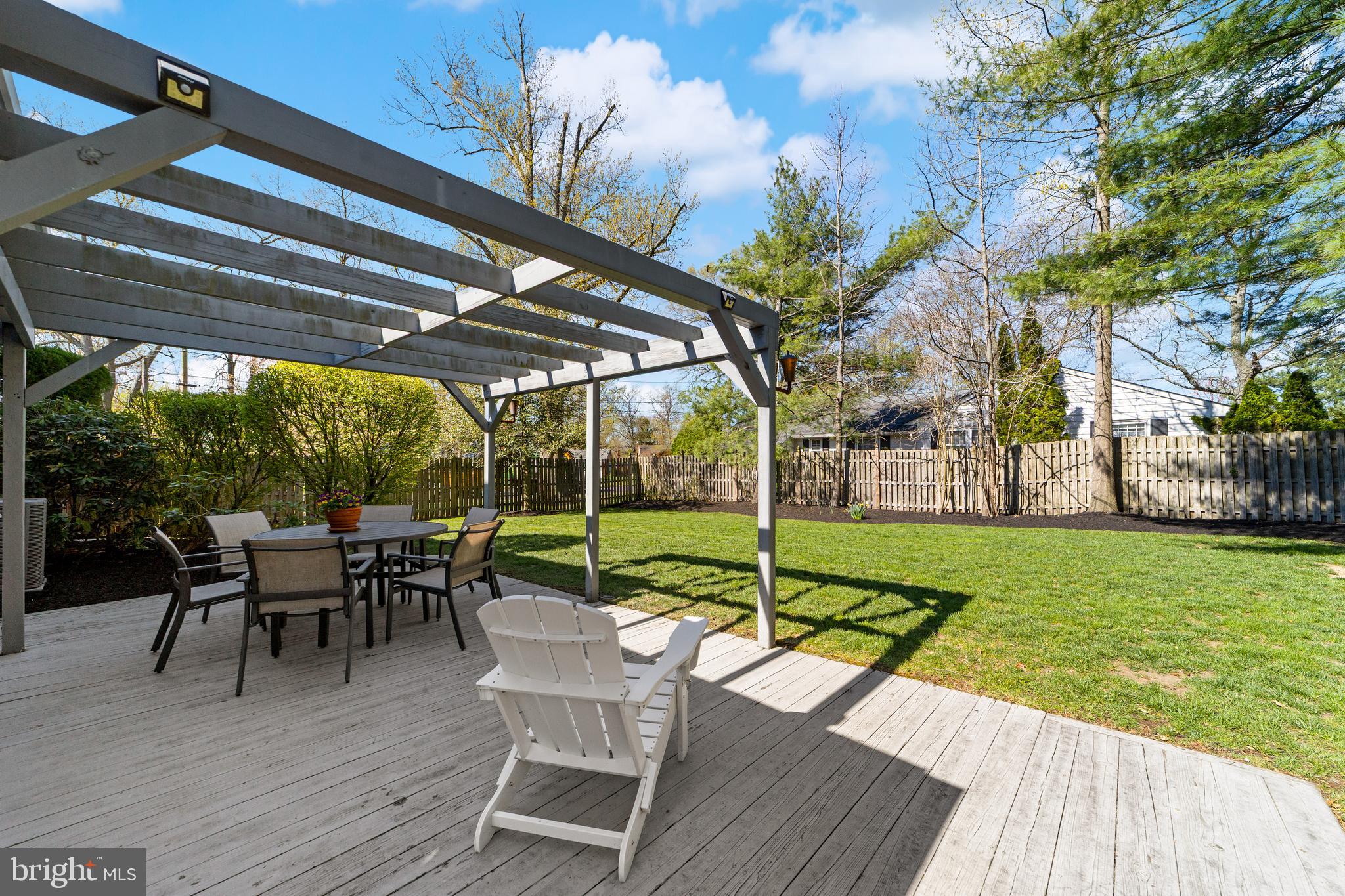 60 Pine Valley Road Cherry Hill, NJ 08034 - Photo 29 of 30 a view of a patio with table and chairs potted plants with wooden floor