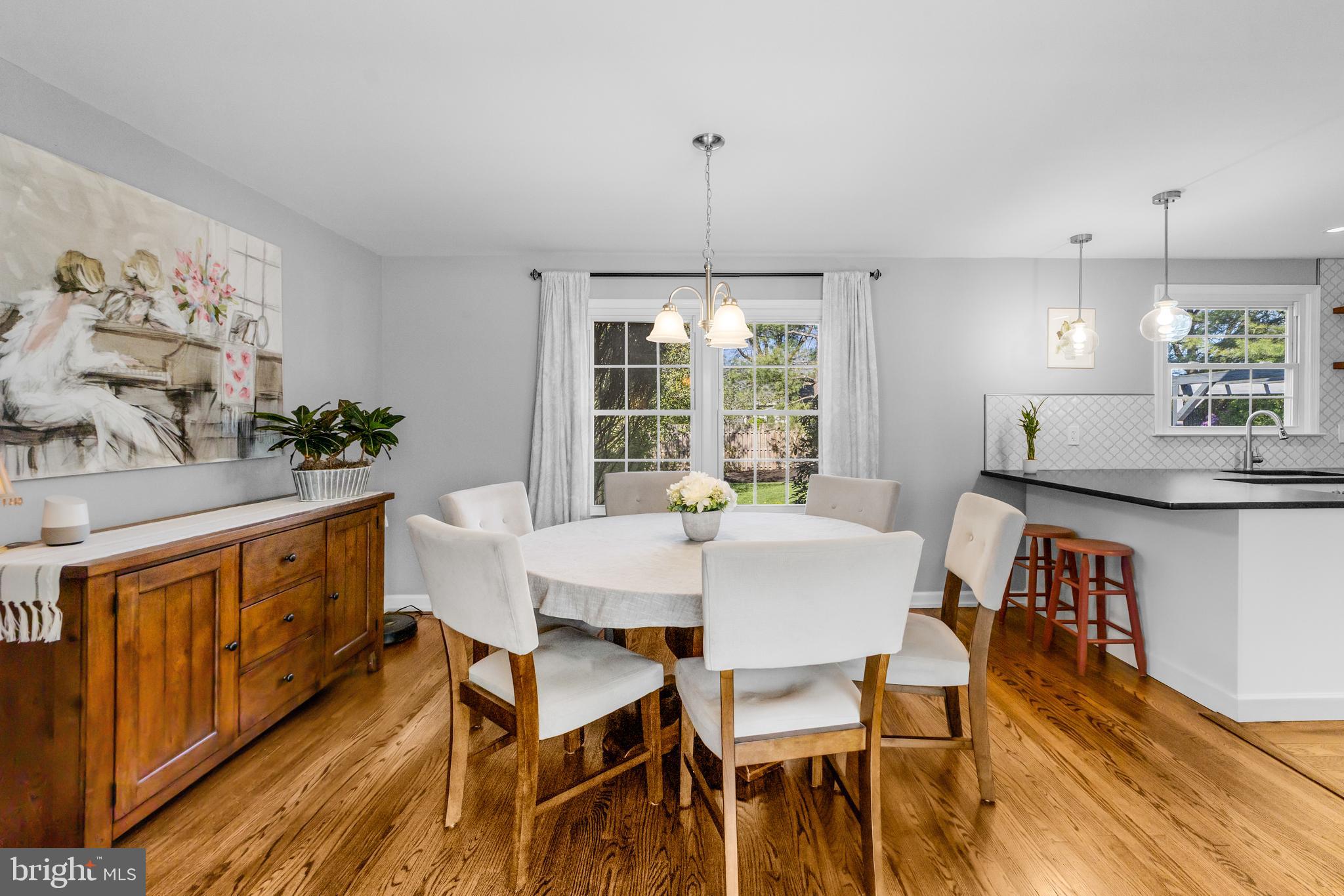60 Pine Valley Road Cherry Hill, NJ 08034 - Photo 6 of 30 a dining room with furniture a chandelier and wooden floor