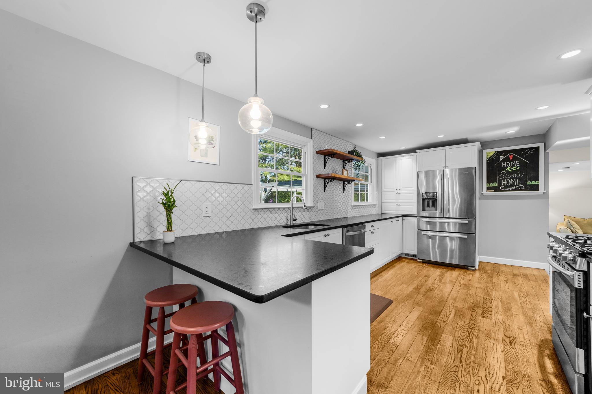 60 Pine Valley Road Cherry Hill, NJ 08034 - Photo 9 of 30 a kitchen with stainless steel appliances granite countertop a sink a stove and a refrigerator