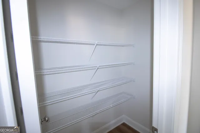 a view of an empty walk in closet
