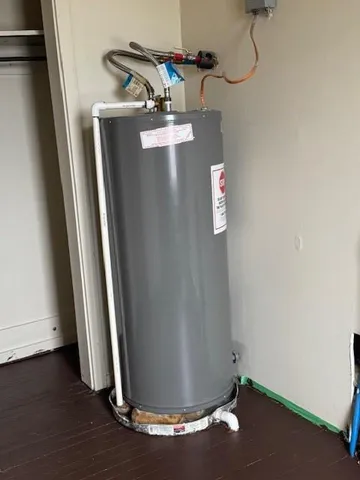 a view of a room with wooden floor and windows