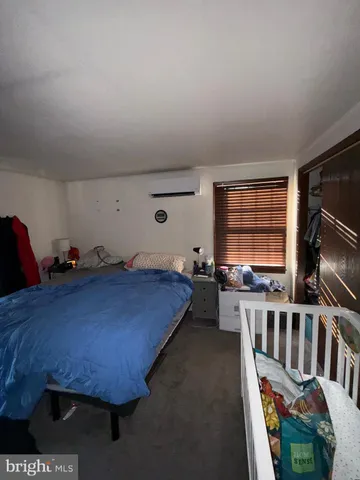 a bed room with furniture and a window