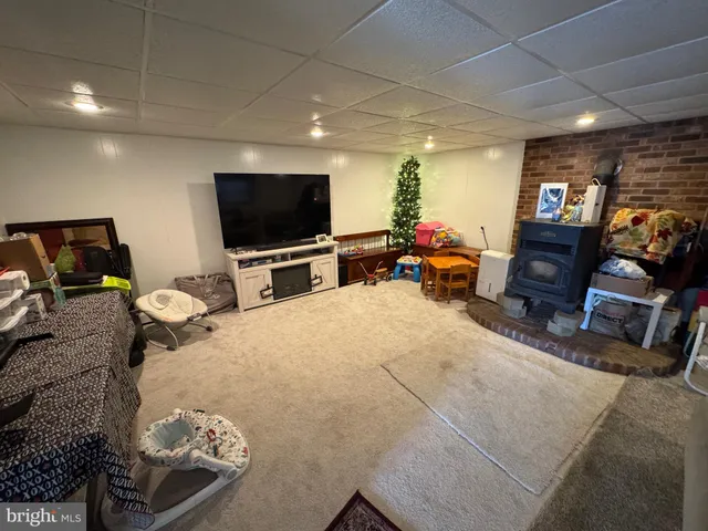 a bedroom with furniture and a flat screen tv
