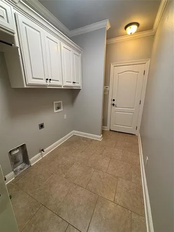 a view of cabinets and utility room